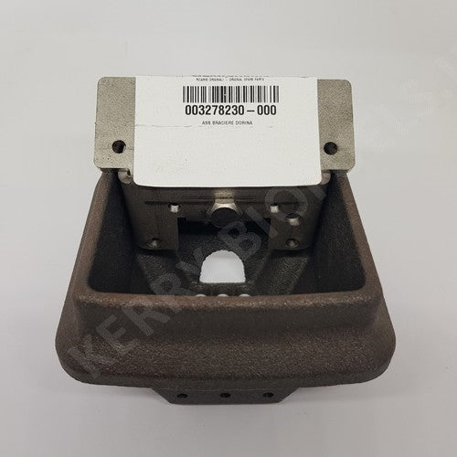 A cast iron and steel burn pot with a label indicating the model number and brand, Extraflame.