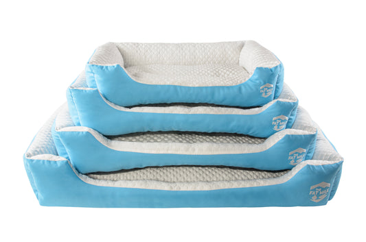 A set of cooling dog beds in blue and white colors, designed with a deep sleeping contour. Cool to the touch. A The Fat Mile logo on the right side.