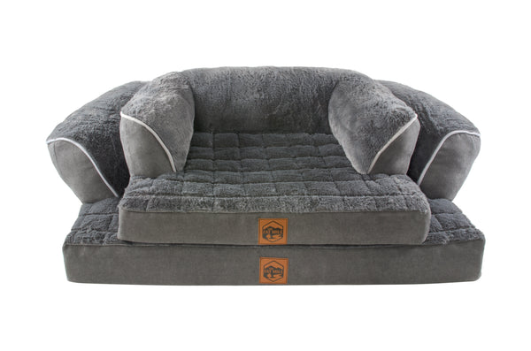 A gray sofa bed with an orthopaedic base, plush cushions and a waterproof base, designed for pet relaxation.