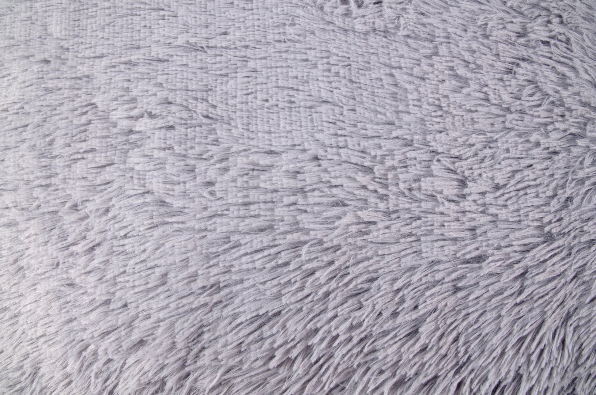 A soft, gray plush cushion designed for pets. Different sizes. Soft.