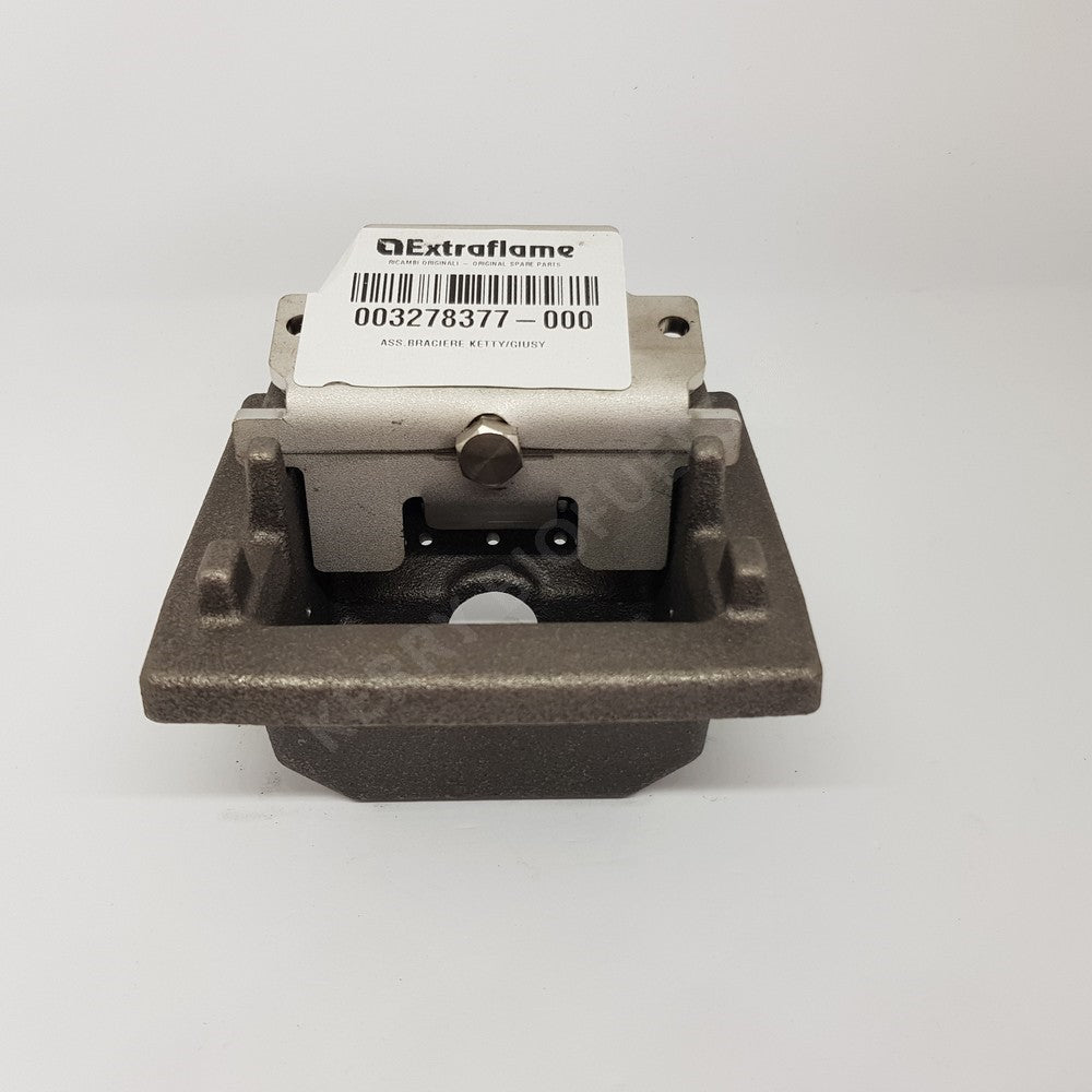 A cast iron and steel burn pot with a label indicating the model number and brand, Extraflame.