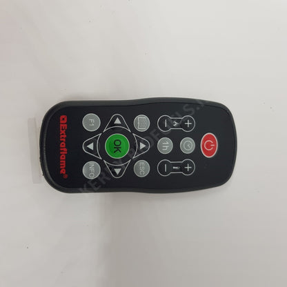 A black remote control with buttons for a fireplace, including an 'OK' button, a 'FN' button, and other control buttons.