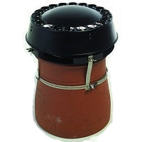 A black mad anti downdraught cowl strapped down on a chimney pot.