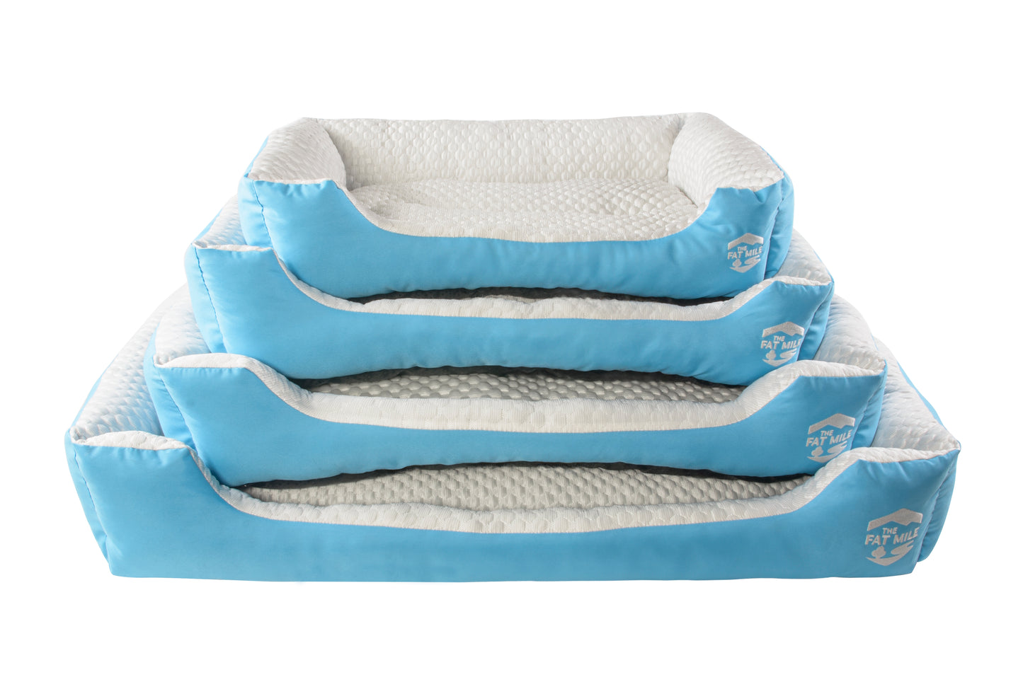 A set of cooling dog beds in blue and white colours, designed with a deep sleeping contour. Cool to the touch. A The Fat Mile logo on the right side.
