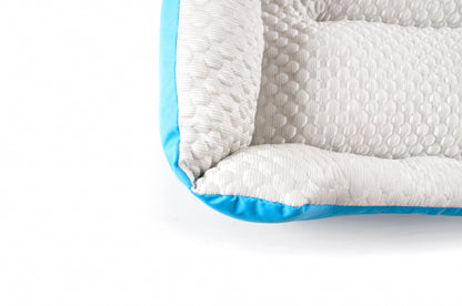 A set of cooling dog beds in blue and white colours, designed with a deep sleeping contour. Cool to the touch. A The Fat Mile logo on the right side.