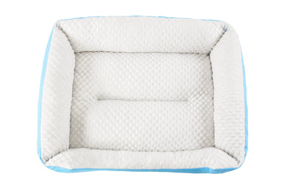 A set of cooling dog beds in blue and white colours, designed with a deep sleeping contour. Cool to the touch. A The Fat Mile logo on the right side.